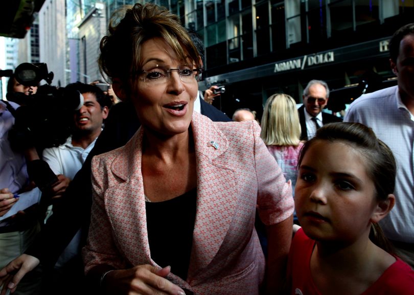 FILE - In this May 31, 2011 file photo, former Alaska Gov. Sarah Palin walks to the door of Trump Tower for a scheduled meeting with Donald Trump in New York. Thousands of Palin's emails from her first two years as governor are being released by the state of Alaska, a disclosure that has taken on national prominence as she flirts with a run for the presidency. (Craig Ruttle / Fr61802 Ap)