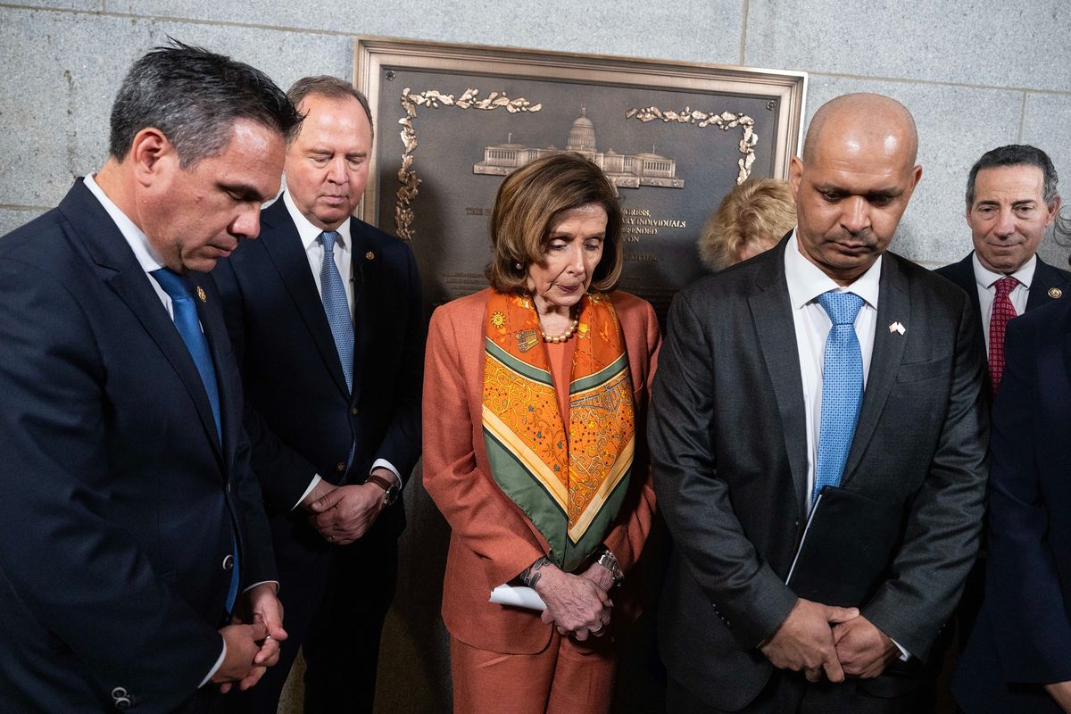 From left, Rep. Pete Aguilar, D-Calif., Sen. Adam Schiff, D-Calif., Rep. Nancy Pelosi, D-Calif., former Capitol Police Officer Aquilino Gonell and Rep. Jamie Raskin, D-Md., bow their heads in a moment of silence in front of a plaque that honors the Capitol Police and law enforcement that defended the U.S. Capitol during the Jan. 6, 2021, attack, on Wednesday, March 25, 2026. (Tom Williams/CQ Roll Call via ZUMA Press/TNS)  (Tom Williams/CQ Roll Call/ZUMA Press/TNS)