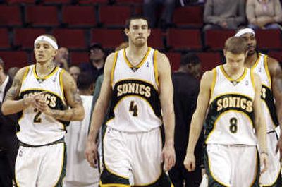 
Associated Press Nick Collison, center, and Luke Ridnour (right) could be playing their final game in Seattle tonight.
 (Associated Press / The Spokesman-Review)