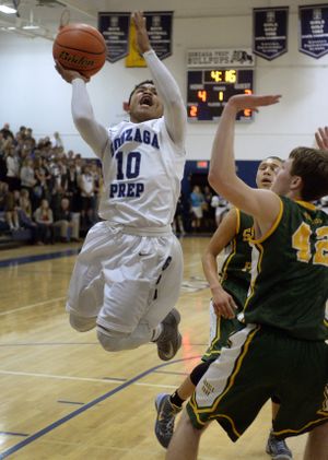 Gonzaga Prep's Sam Dowd flies to the basket during the first half of a GSL high school basketball game against Shadle, Friday, Jan.10, 2014, at Gonzaga Preparatory School. (Colin Mulvany / The Spokesman-Review)
