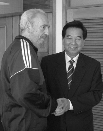 
Cuban President Fidel Castro shakes hands with Wu Guanzheng in Havana  on Friday. 
 (Associated Press / The Spokesman-Review)