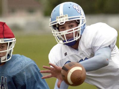 
Central Valley's Camren Ebat catches the ball in a recent after-school practice.
 (Liz Kishimoto / The Spokesman-Review)