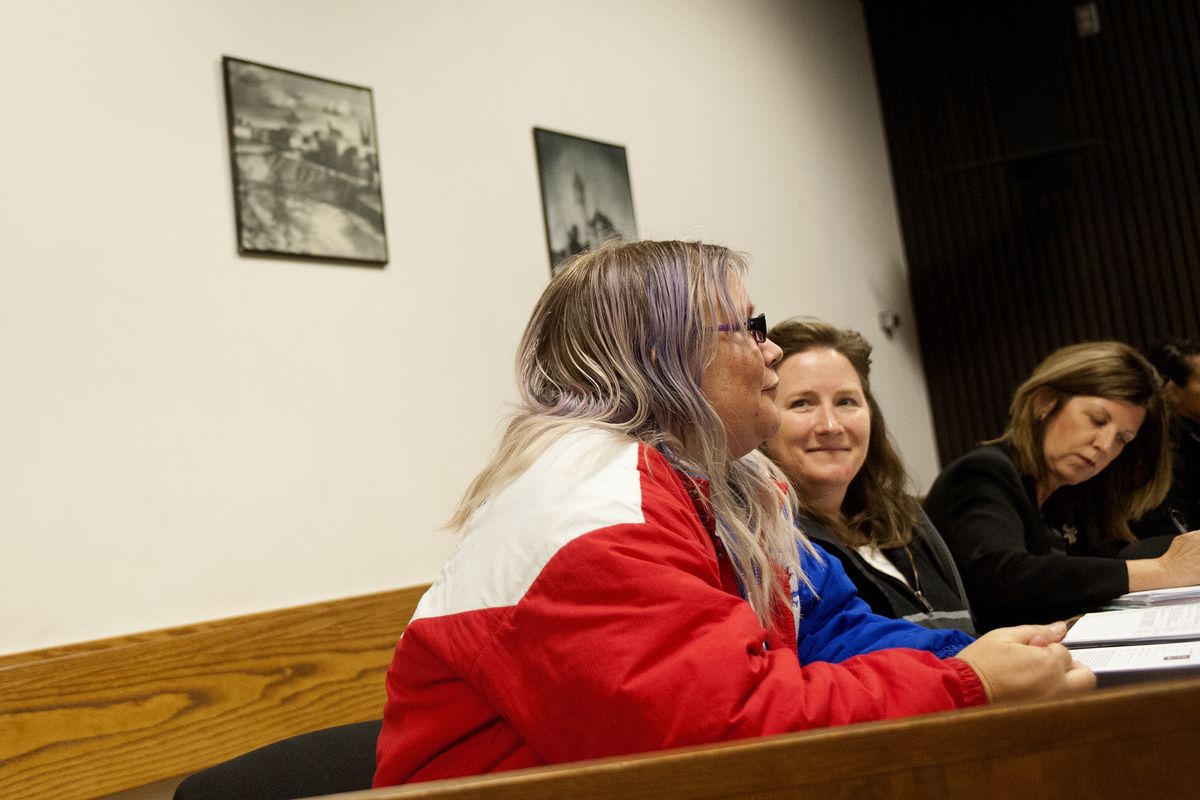 Heidi Everett, left, speaks with Judge Randy Brandt on Oct. 9 while case managers Kim Hammond, center, and Barbara Folden listen. (Tyler Tjomsland)
