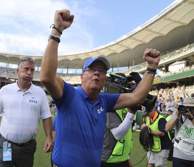 In this Sept. 15, 2018, file photo, Duke head football coach David Cutcliffe celebrates after a 40-27 win over Baylor in an NCAA college football game, in Waco, Texas. Major college football teams are on a record scoring pace this season and a more aggressive approach on fourth down is helping to fuel the surge. (Rod Aydelotte / Waco Tribune-Herald via AP)