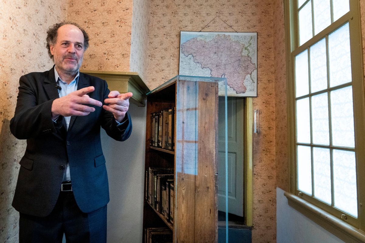 Ronald Leopold, executive director Anne Frank House, gestures as he talks next to the passage to the secret annex during an interview in Amsterdam, Netherlands, Monday, Jan. 17, 2022. A cold case team that combed through evidence for five years may have solved one of World War II