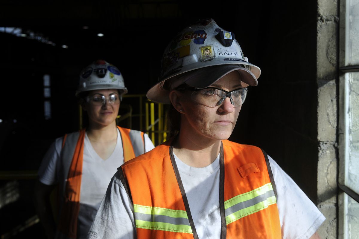 Sally Dunn, right, and Melody Ross work in the assay lab at the Pend Oreille Mine in Metaline Falls, Wash.  A downturn in the nation