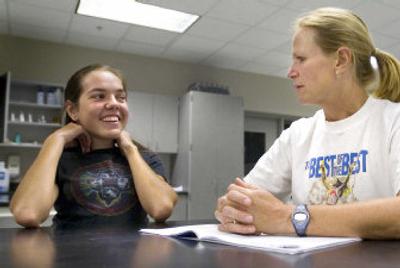 
Horton, left, jokes around with assistant coach Jennifer Stalwick before  practice.
 (The Spokesman-Review)