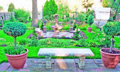 
The well-decorated garden is full of metal sculptures, pots and flower beds of unusual shapes and sizes. 
 (File/ / The Spokesman-Review)