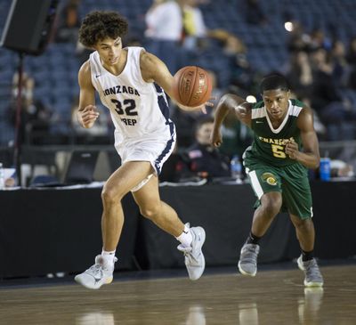 Gonzaga Prep’s Anton Watson dribbles downcourt during in a 4A state tournament victory in February. (PATRICK HAGERTY / SR)