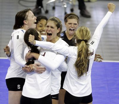 Stanford players celebrate NCAA volleyball semifinal win over Texas.  (Associated Press / The Spokesman-Review)