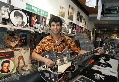 Wolfgang Hahn, who calls himself Wolf Memphis, poses in his Elvis4You shop in downtown Vienna that sells Elvis Presley music, memorabilia and trinkets. 
 (Associated Press / The Spokesman-Review)
