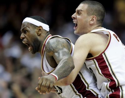 Associated Press Sasha Pavlovic, right, hugs LeBron James, whose last-second 3-pointer Friday turned back Orlando 96-95 in the Eastern Conference finals. (Associated Press / The Spokesman-Review)
