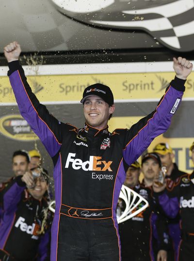 Denny Hamlin celebrates his second career win at the NASCAR Sprint Unlimited exhibition race. (Associated Press)