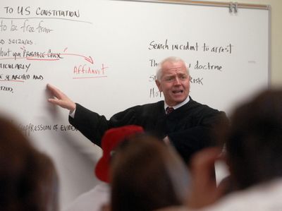 Spokane County District Judge Richard White talk  to a West Valley High School social studies class Thursday. The judge and the students discussed  searches and seizure and probable cause.  (J. BART RAYNIAK / The Spokesman-Review)