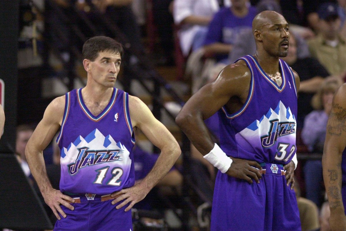Utah Jazz’s John Stockton, left, and Karl Malone during their final playoff game together, a 111-91 loss to the Sacramento Kings on April 30, 2003, in Sacramento, Calif.  (RICH PEDRONCELLI/Associated Press)
