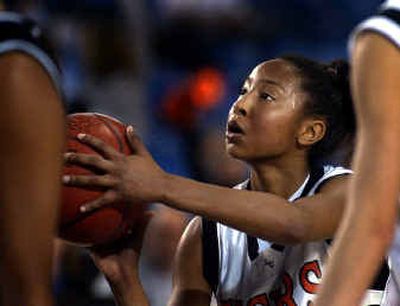 
 Shooting has not been Briann January's focus, but she has responded to her team's need this season with a 15.0 average. 
 (Christopher Anderson/ / The Spokesman-Review)