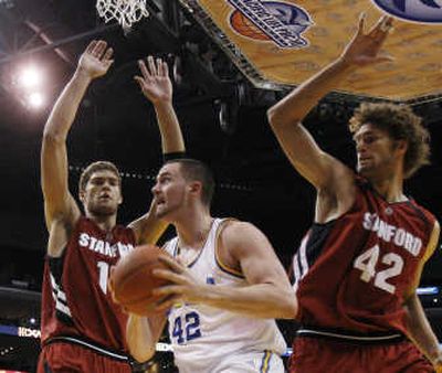 
Associated Press  Brook Lopez, left, and twin  Robin defend UCLA's Kevin Love. All three are expected to be first-round picks Thursday.
 (File Associated Press / The Spokesman-Review)