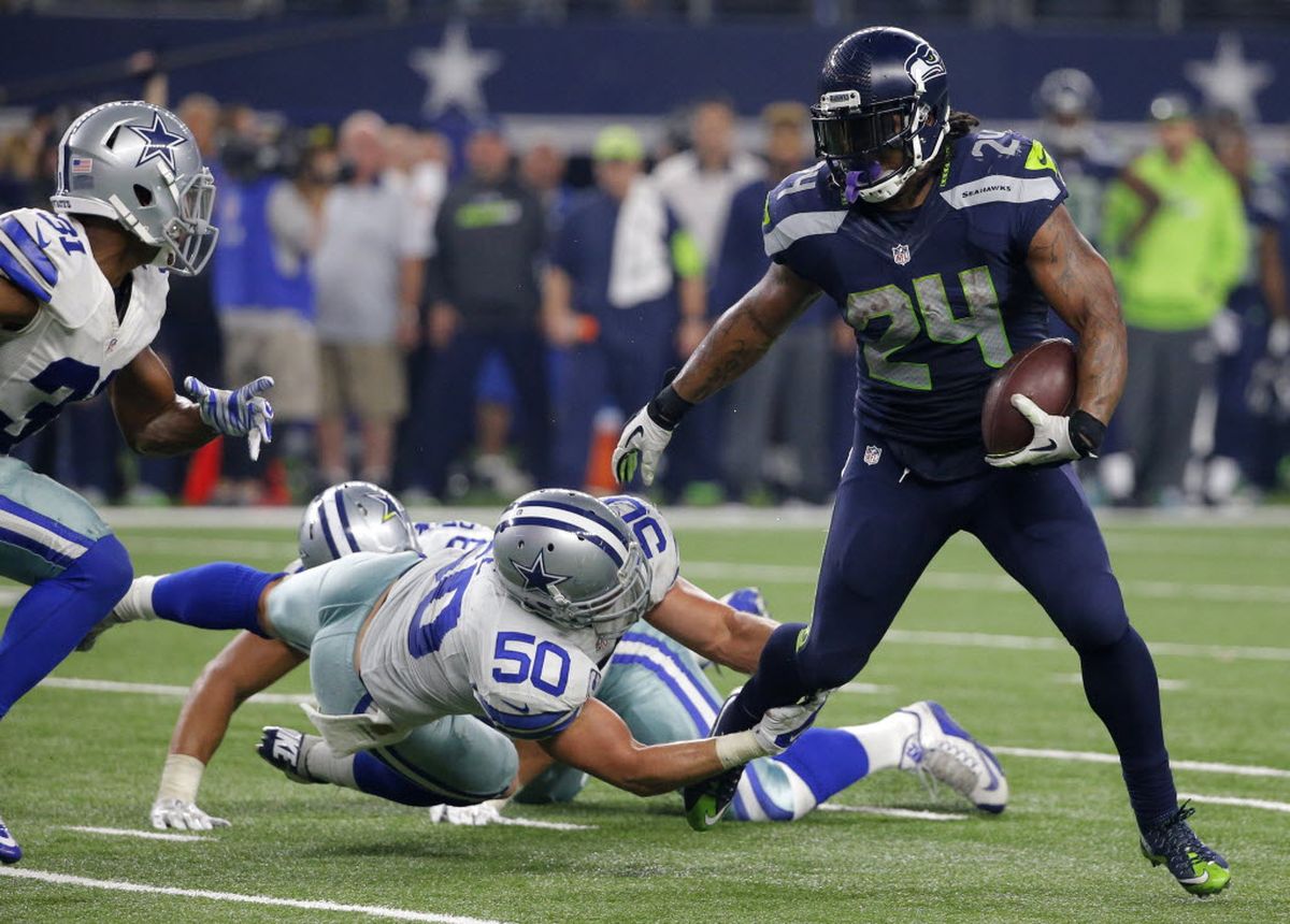 Seattle Seahawks running back Marshawn Lynch (24) looks over at