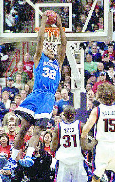 
Memphis' Joey Dorsey starts the game with a reverse dunk. 
 (Dan Pelle / The Spokesman-Review)