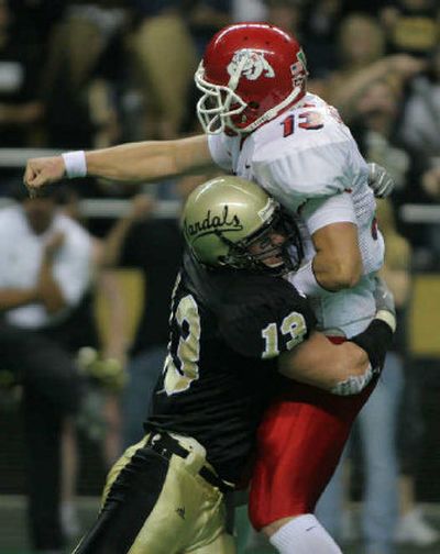 
The University of Idaho's defense played effectively in the first half on Saturday at the Kibbie Dome, as evidenced by linebacker Mike Anderson's sack of Fresno State quarterback Paul Pinegar. 
 (Associated Press / The Spokesman-Review)