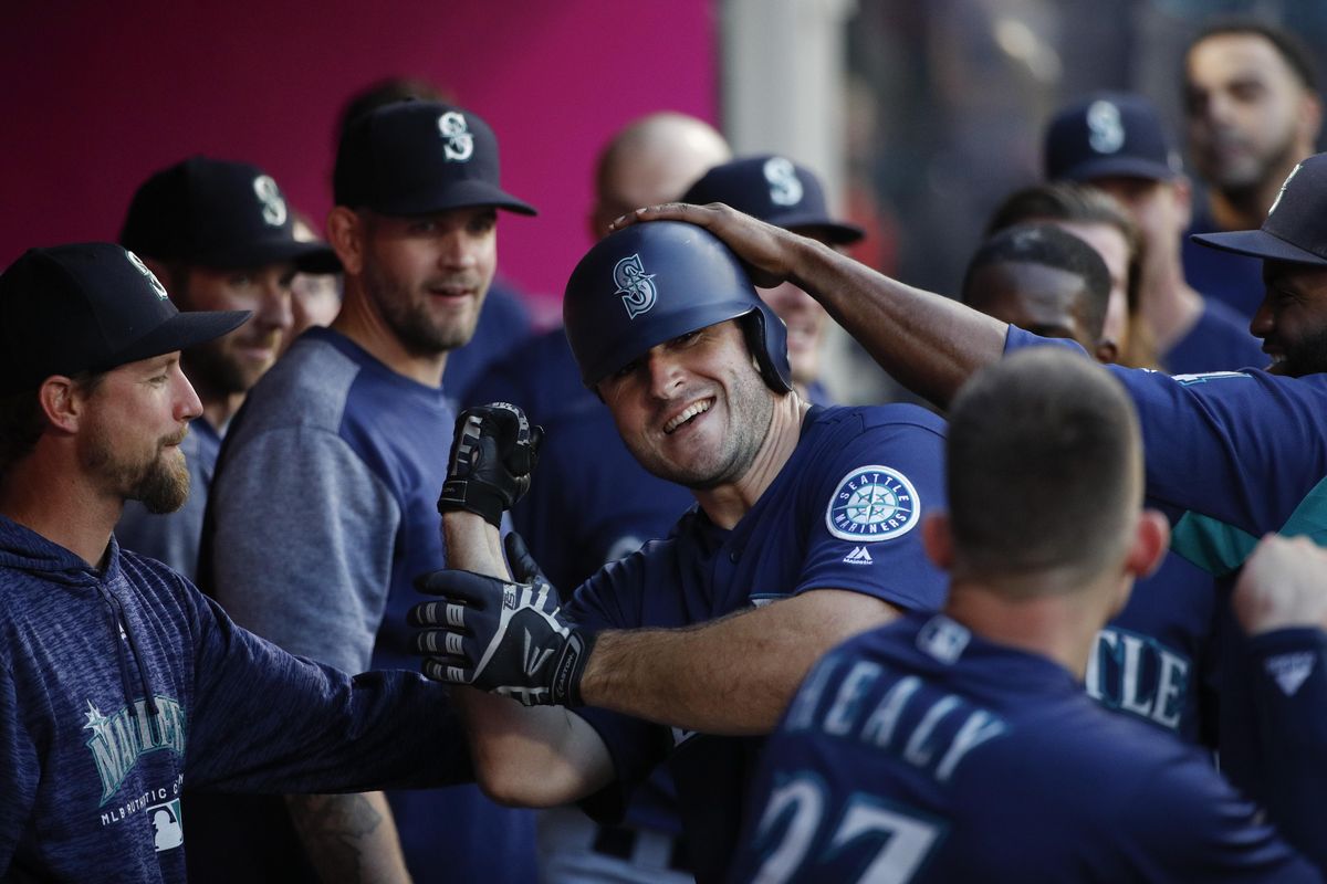 Seattle’s David Freitas, center, is congratulated by teammates in the dugout after hitting a home run during the third inning against the Los Angeles Angels on Wednesday in Anaheim, Calif. (Jae C. Hong / AP)