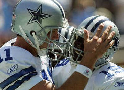 
Cowboys quarterback Drew Bledsoe, left, greets Keyshawn Johnson after Johnson's second touchdown catch of the game. 
 (Associated Press / The Spokesman-Review)