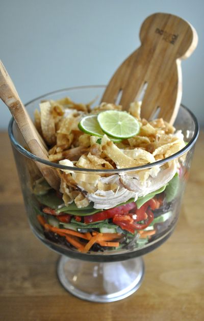 Lesley Dalke’s layered salad with lime vinaigrette and Thai peanut sauce packs flavor. (Adriana Janovich)