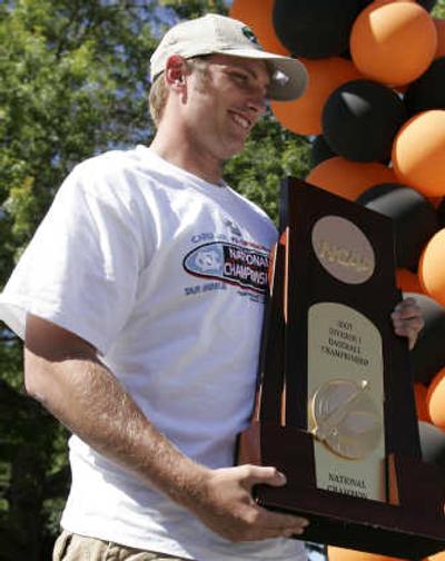 
Oregon State pitcher Joe Paterson holds the championship trophy during Monday's victory party.Associated Press
 (Associated Press / The Spokesman-Review)
