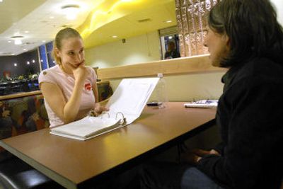 
Debbie Baril, right, talks about life and careers with Alisha Presson at Spokane Community College.  Baril volunteers as a mentor with Project MOVE, which matches mentors with youths. 
 (Jesse Tinsley / The Spokesman-Review)