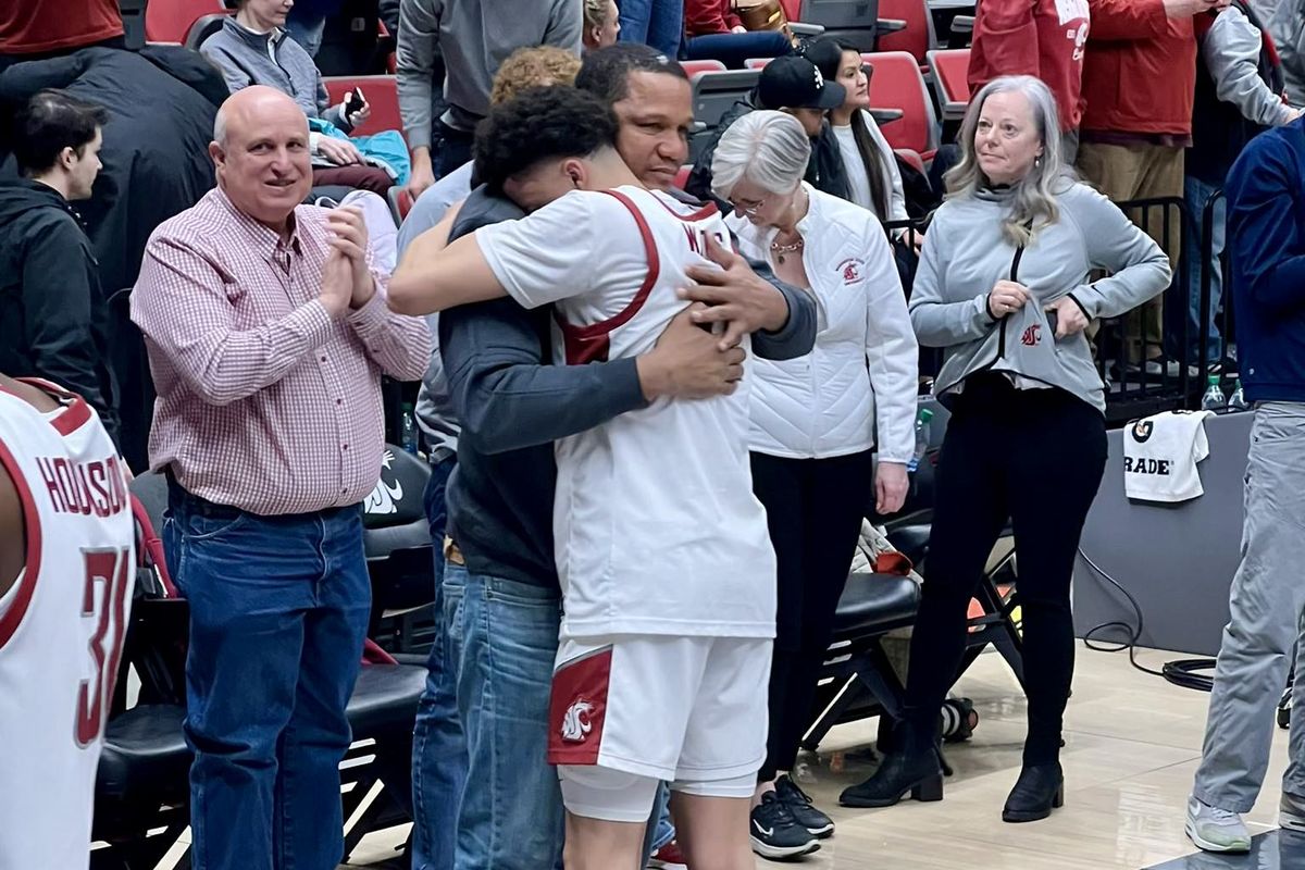 Washington State freshman Isaiah Watts embraces his father Donald after the Cougars’ Pac-12 Conference win over USC last Thursday in Pullman.  (Courtesy of Donald Watts)