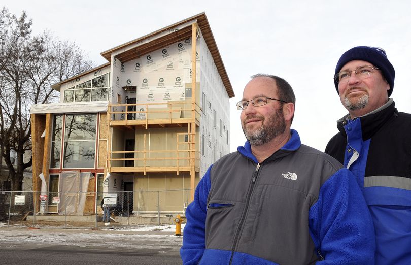 Buzz Price, left, owner and Chris Hall, project manager, are constructing high-end student housing near the Gonzaga campus. The building will be called the Gee.  (Dan Pelle)