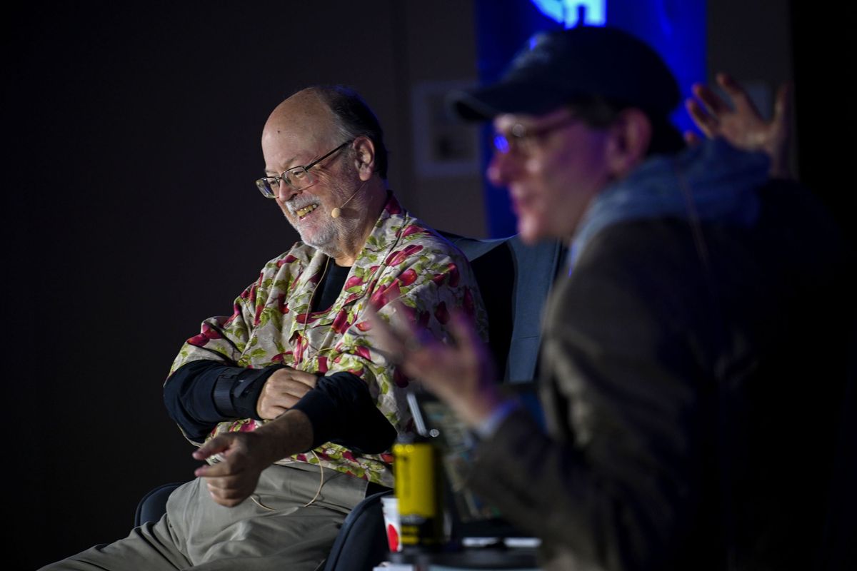 Spokesman-Review Design Editor Charles Apple, left, and Spokesman-Review Editor Rob Curley talk about Further Review, Apple’s nationally distributed coffee table book, transforming historical narratives into visually captivating, bite-sized revelations during a Northwest Passages event Sunday at Gonzaga University’s Myrtle Woldson Performing Arts Center.  (Kathy Plonka/The Spokesman-Review)