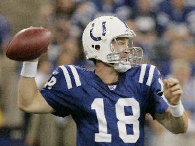 
Peyton Manning passed for 400 yards, 3 TDs for Colts.  
 (Associated Press / The Spokesman-Review)