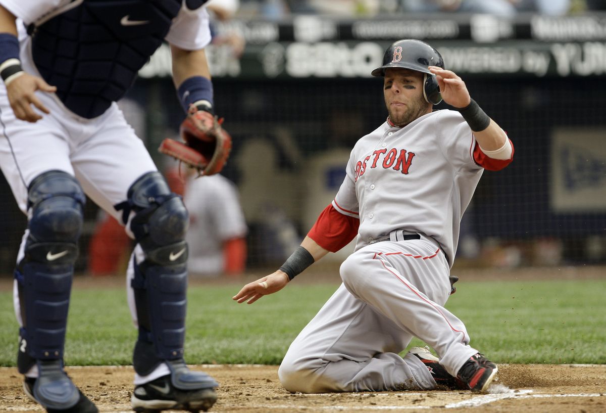 Boston’s Dustin Pedroia scored this run in the third inning and contributed to the game-winning theatrics in the 12th. (Associated Press / The Spokesman-Review)