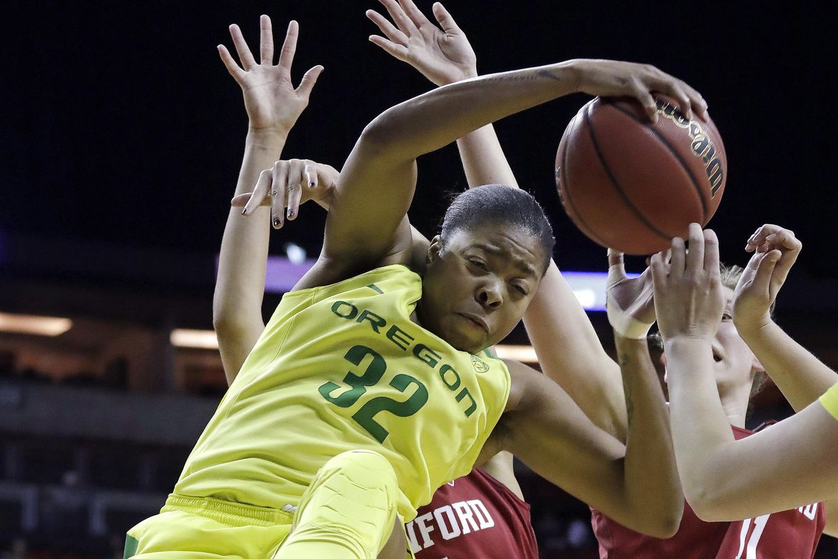 Oregon’s Oti Gildon rebounds against Stanford during the Pac-12 Conference Tournament championship, March 4 in Seattle. (Elaine Thompson / Associated Press)