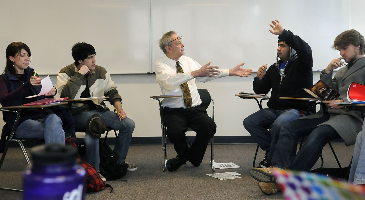 Whitworth University professor Leonard Oakland engages student John Dorrenbacher with a discussion about the teachings of Plato during class last week. Other students include, from far left, Christina Froese, Sean Pullin and, at far right, Ryan Gerhard.  (Dan Pelle / The Spokesman-Review)