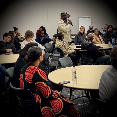 Elysee Kazadi speaks about briding gaps within the African diaspora on Feb. 20 during an NAACP Spokane town hall at Spokane Community College.   (April Eberhardt/The Black Lens)