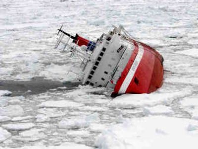 Above: In this photo released by Chile's Navy, the Liberian-flagged Explorer cruise ship is seen sinking Nov. 23 after it hit an object in Antarctic waters, some 880 kilometers southeast of Ushuaia, the southernmost Argentine city. More than 150 passengers and crew took to lifeboats after the ship began taking on water through a hole in the hull, naval and coast guard officials said. Left: A file photo made available from Museum of Uusikaupunki, Finland, shows the Explorer before it sank. Built in 1969 in Uusikaupunki Shipyard, Finland, the Explorer was purpose-built as an expeditionary vessel, designed to literally go where no passenger ship had gone before. Associated Press photos
(Associated Press photos / The Spokesman-Review)
