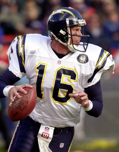 ORG XMIT: NY156 FILE - In this Nov. 19, 2000 file photo, San Diego Chargers quarterback Ryan Leaf rolls out of the pocket as he looks for a receiver in the first quarter against the Denver Broncos in Denver.  Leaf passed for 311 yards in the Chargers 38-37 loss to the Broncos. Leaf's lawyer says the indicted former NFL quarterback will surrender on drug and burglary charges in Texas in June 2009.  (AP Photo/Kevin Higley, File) (Kevin Higley / The Spokesman-Review)