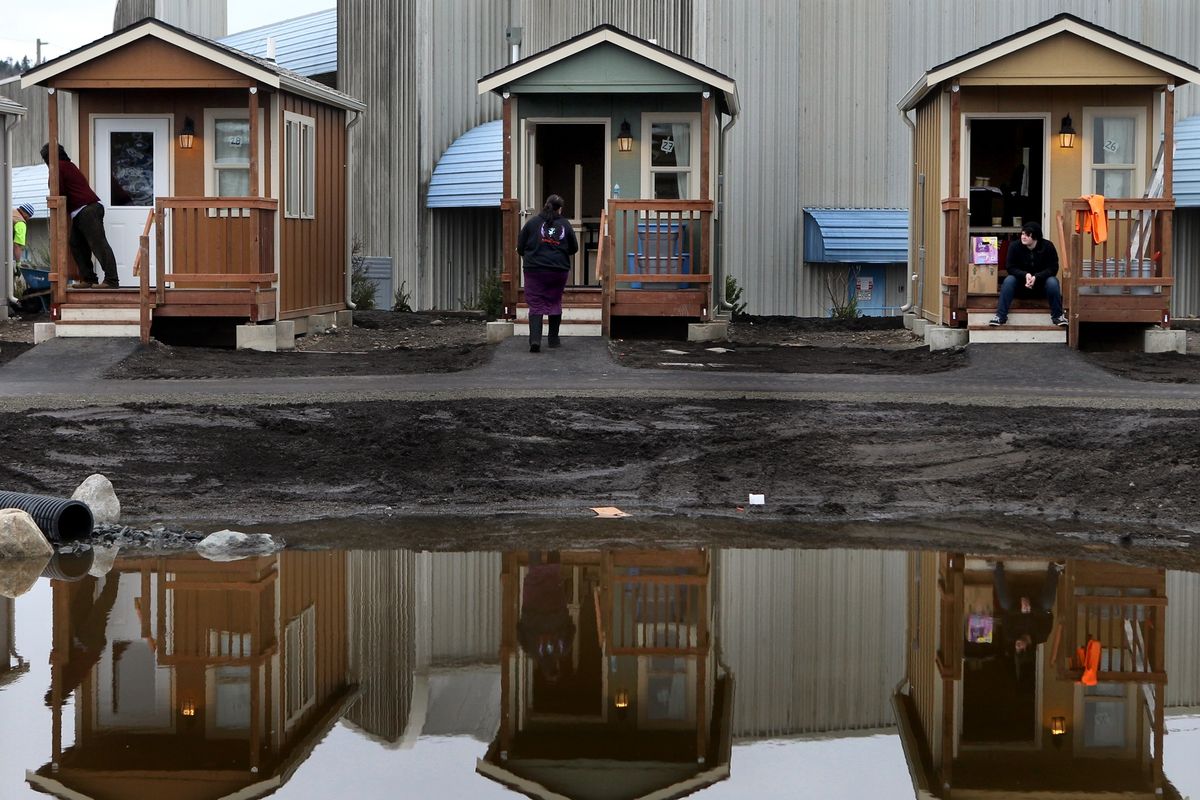People move into Quixote Village, a complex of cottages for the homeless. Occupancy began Christmas Eve. (Associated Press)
