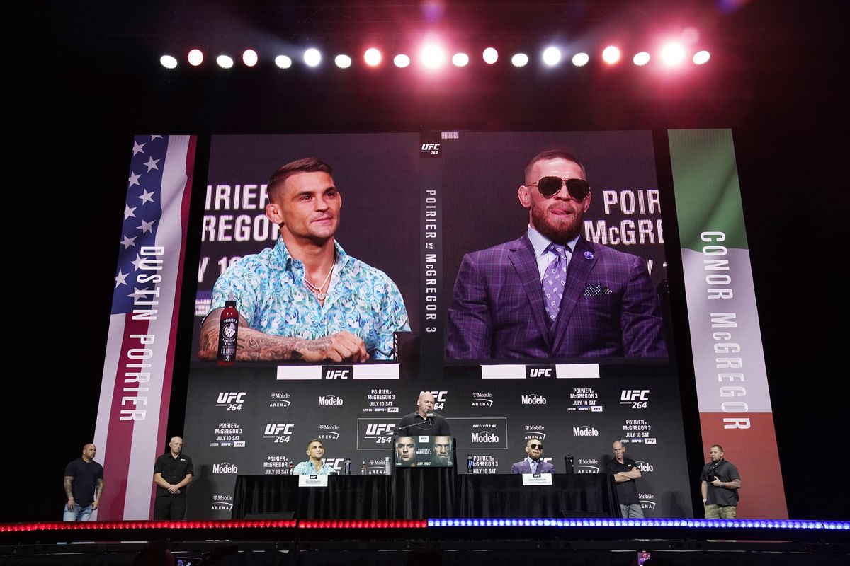 Dustin Poirier, left, and Conor McGregor take part in a news conference for a UFC 264 mixed martial arts bout Thursday, July 8, 2021, in Las Vegas. The two are scheduled to fight in a lightweight bout Saturday.  (John Locher)