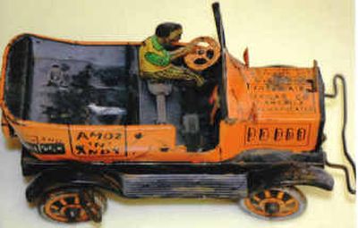 
This 1930 Marx wind-up tin taxi is missing a few key components, but is worth about $250.
 (The Spokesman-Review)