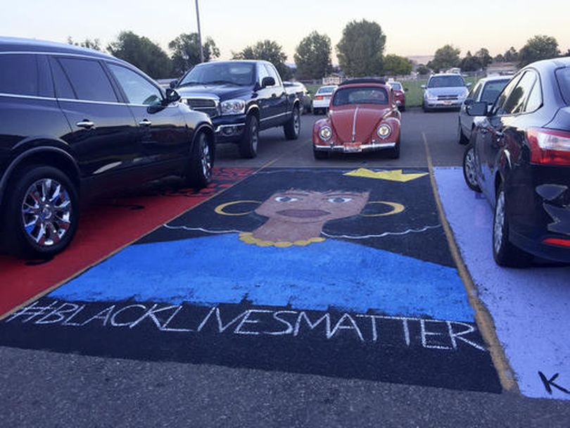 This Monday, Sept. 19, 2016 photo provided by kboi2.com shows a mural that school administrators at Mountain Home High School In southern Idaho say has to be removed because its placement in a school parking lot violates school policy. About 100 students have started a protest amid concerns the 