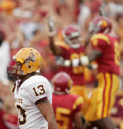 
Emmanuel Franklin of Arizona State turns his back on USC players celebrating Reggie Bush's first-half touchdown. 
 (Associated Press / The Spokesman-Review)