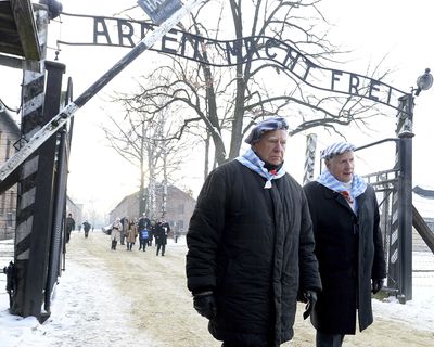 Survivors of Auschwitz gather on the 74th anniversary of the liberation of the former Nazi German death camp in Oswiecim, Poland, on Sunday, Jan. 27, 2019. They wore striped scarves that recalled their uniforms, some with the red letter “P,” the symbol the Germans used to mark them as Poles. The observances come on International Holocaust Remembrance Day. (Czarek Sokolowski / Associated Press)