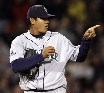 Seattle Mariners starting pitcher Felix Hernandez points to second base after giving up his first hit of the game to Boston Red Sox’s J.D. Drew, during the eighth inning of their baseball game at Fenway Park in Boston, Wednesday, April 11, 2007. (Elise Amendola / Associated Press)