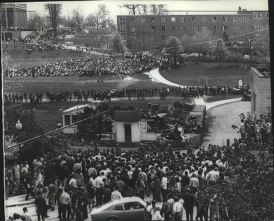 Ohio National Guardsmen from a line across the center of the Kent State University campus during disorders Monday. In the foreground is the burned-out  ROTC building. Behind building at upper left is the spot where four students were fatally shot at the height of the school unrest. (AP (Associated Press))