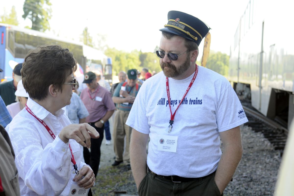 Allan Manson, right, wears a vintage conductor