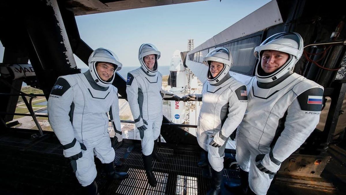 The members of NASA's SpaceX Crew-10 mission stop for a photo on the access arm at launch pad 39A during a rehearsal of launch day on Sunday, March 9. Pictured from left to right are Japan Aerospace Exploration Agency astronaut Takuya Onishi, NASA astronauts Nichole Ayers and Anne McClain, and Russian cosmonaut Kirill Peskov.  (Courtesy of NASA)