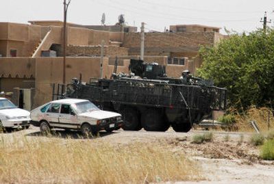 
A U.S. Stryker vehicle moves through a Sunni-populated area Saturday in Baghdad, Iraq. The U.S. Army moved 3,700 soldiers of the 172nd Stryker Brigade from northern Iraq to the capital. 
 (Associated Press / The Spokesman-Review)